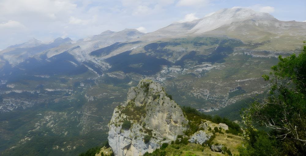 Puntón de las Brujas, Tella, Huesca, Spain – The Land of the Witches." The image captures the striking rock formation known as the Puntón de las Brujas (Witches' Peak), a place shrouded in local legend.