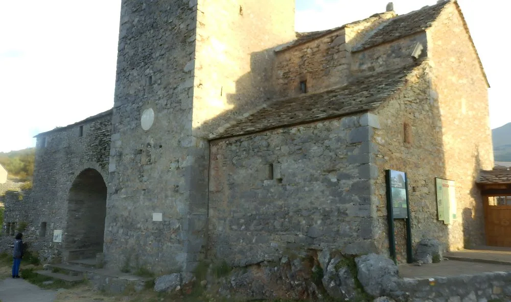 San Martín Church, Tella, Huesca, Spain – The Land of the Witches. The image showcases the historic San Martín Church, a Romanesque-style stone church nestled in the mystical village of Tella, in the Pyrenees.