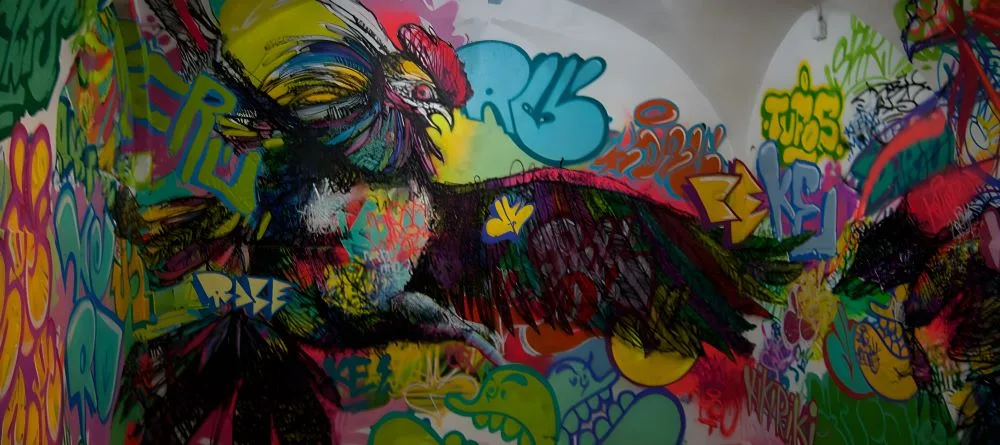 Graffiti artwork from CSA La Tabacalera, Madrid, Spain. The image showcases the vibrant street art culture within the self-managed social center, reflecting themes of activism, creativity, and urban expression.