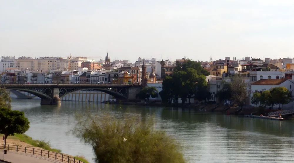 Triana's Colorful Embrace: Stroll through Seville's spirited barrio, where art, tradition, and the echoes of flamenco enliven the soul of the city.