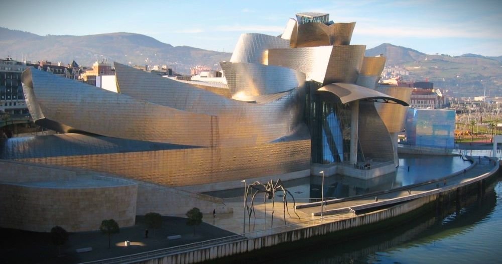 The Guggenheim Bilbao: A Modernist Marvel of Titanium and Glass, Shaping the Skyline with its Futuristic Contours.