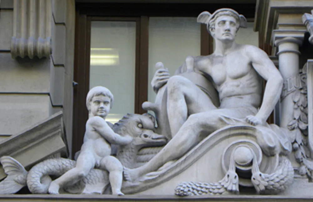 culpture of Hermes and a child in the building of the headquarters of the National Institute of Statistics, Via Laietana (Barcelona).