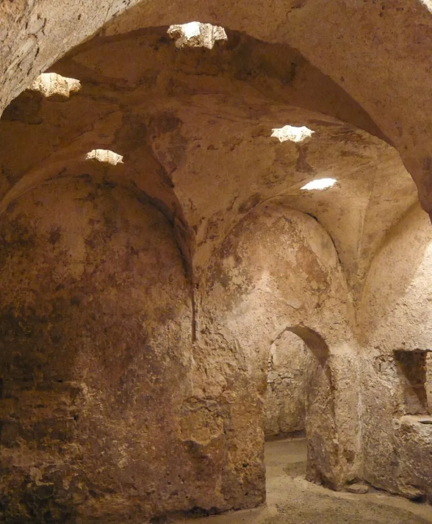Royal Baths at the Alcázar of the Christian Monarchs, Córdoba, Spain [Edited Photograph]. Credit: Turol Jones, un artista de cojones. Licensed under CC BY 2.0. 