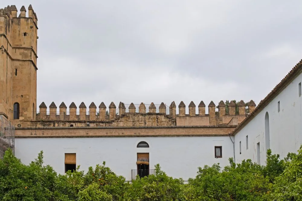 Northwestern Wall of the Morisco Courtyard, Alcázar of the Christian Monarchs, Córdoba, Spain [Edited Photograph]. Credit: Ymblanter. Licensed under CC BY-SA 4.0.