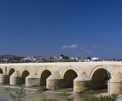 CĂłrdoba's Timeless Bridge: Spanning the Guadalquivir River, the Roman Bridge connects the Campo de la Verdad with the Cathedral Quarter, standing as the city's sole bridge for two millennia until the mid-20th century.