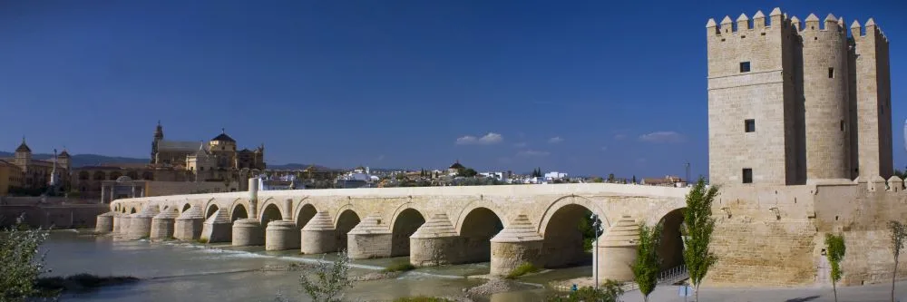 Córdoba's Timeless Bridge: Spanning the Guadalquivir River, the Roman Bridge connects the Campo de la Verdad with the Cathedral Quarter, standing as the city's sole bridge for two millennia until the mid-20th century.