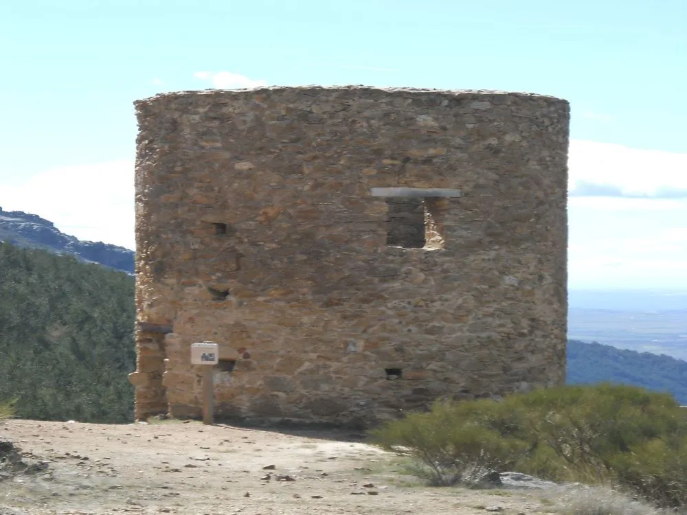 Standing tall against the sky, the historic Torre de la Mina in Bustarviejo serves as a silent guardian of the town's rich mining heritage.