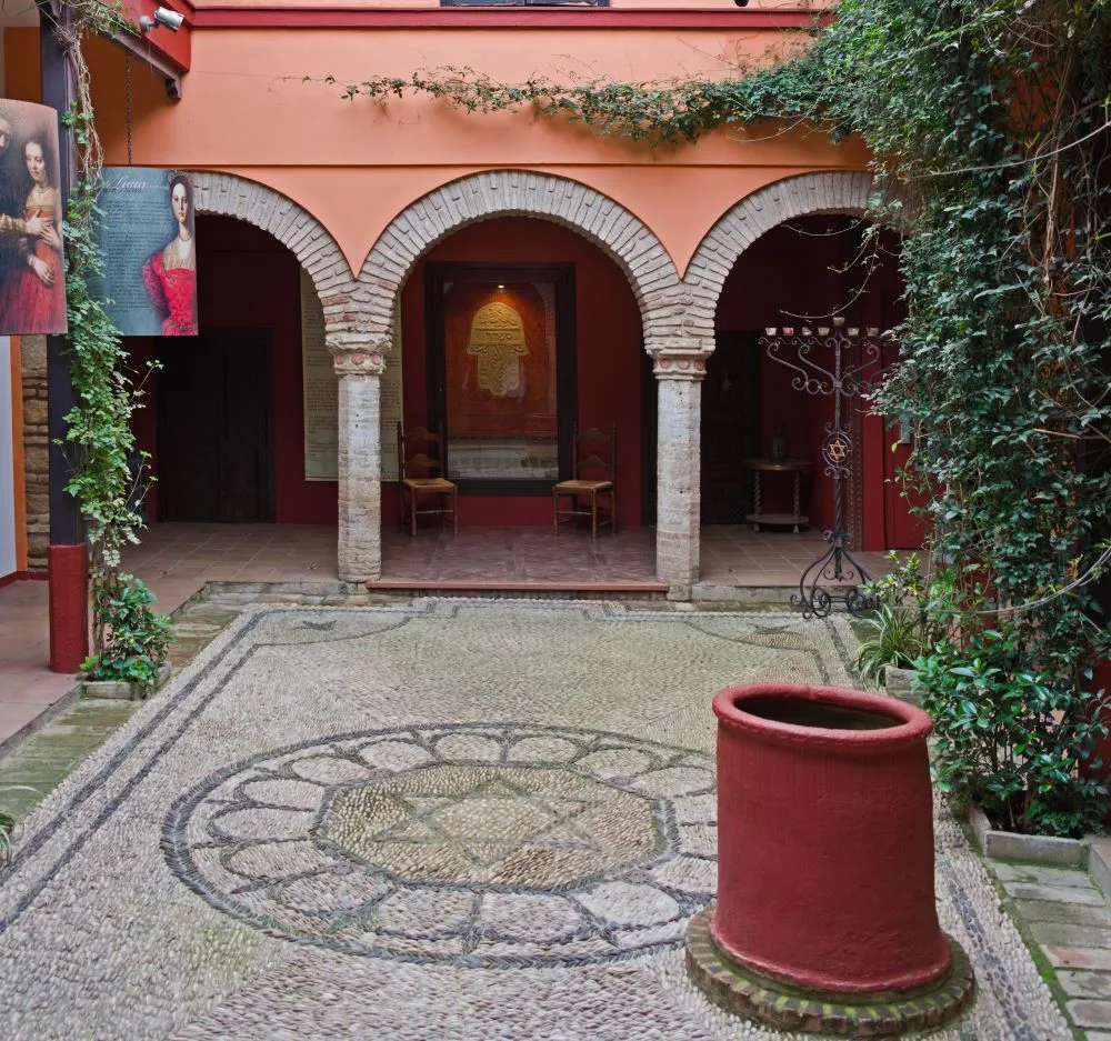 The serene courtyard of the Casa de Sefarad in Córdoba, a cultural center dedicated to preserving the history and heritage of Sephardic Jews.