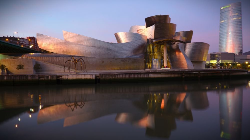 Twilight view of the Guggenheim Museum Bilbao, Spain [Photograph]. Credit: PA. Licensed under CC BY-SA 4.0