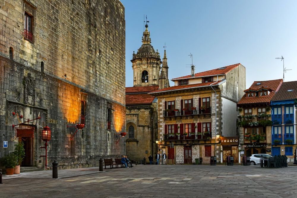 Parador de Hondarribia and Church of Nuestra Señora de la Asunción y del Manzano, Hondarribia, Basque Country, Spain [Edited Photograph]. Credit: Jorge Franganillo. Licensed under CC BY 2.0. 