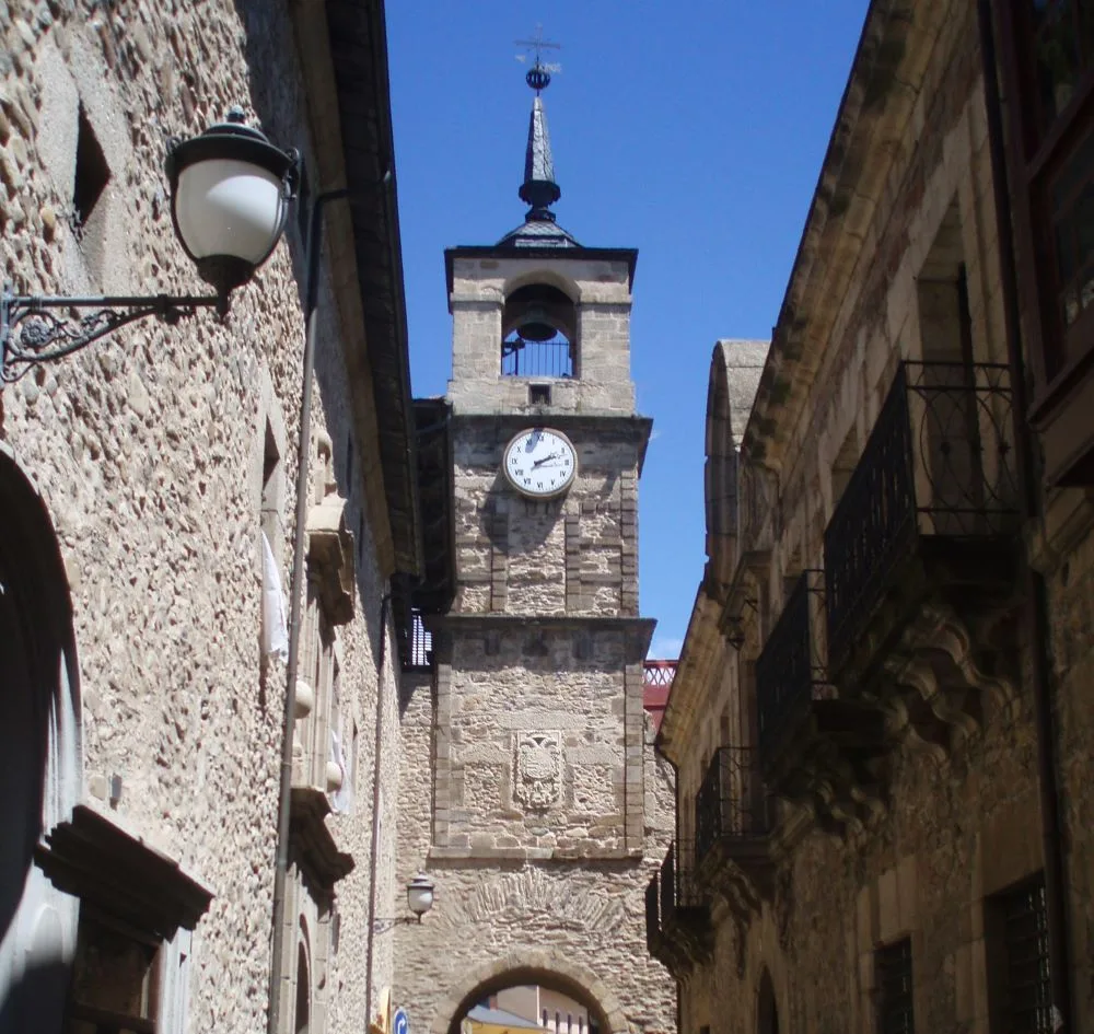 The Torre del Reloj in Ponferrada, Spain, a historic clock tower standing over the old town's cobbled streets, showcasing its medieval charm and significance.