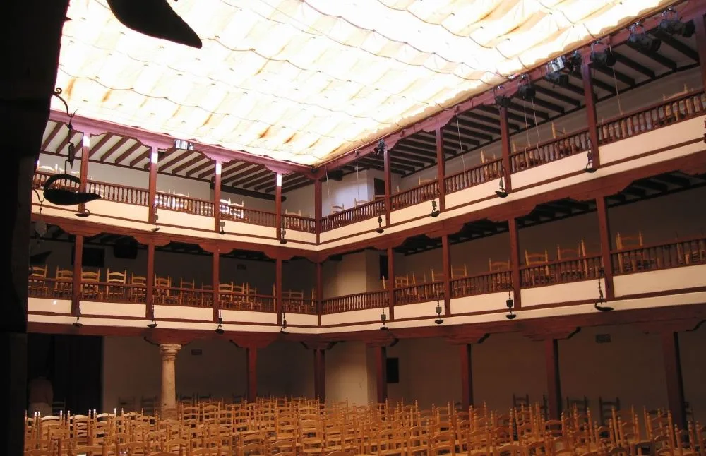 An interior view of the Corral de las Comedias in Almagro, Castilla-La Mancha, Spain, showcasing its wooden galleries and stage, preserving Spain’s Golden Age theater tradition.
