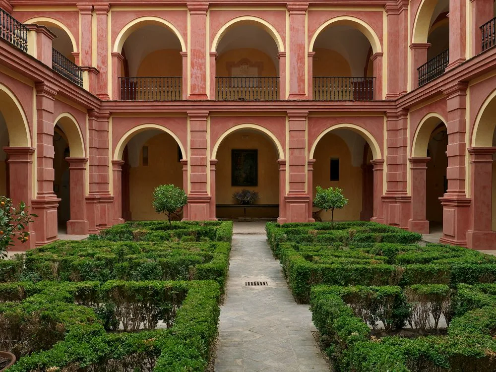Main cloister of the Convent of San Francisco, Palma del Río, Spain [Photograph]. Credit: José Luis Filpo Cabana via Wikimedia Commons. Licensed under CC BY 4.0. 