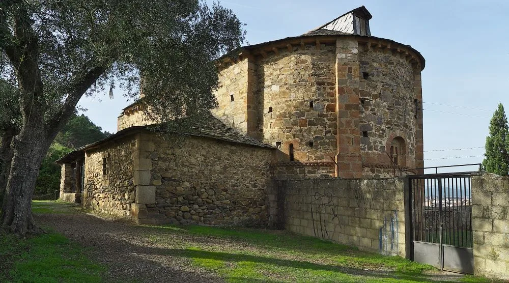 The Iglesia de Santa María de Vizbayo in Ponferrada, Spain, one of the oldest Romanesque churches in El Bierzo, featuring simple yet historic stone architecture from the 11th century.