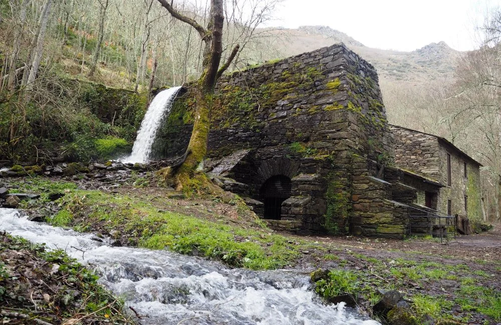 The Herrería de Compludo near Ponferrada, Spain, an ancient blacksmith forge dating back to the early Middle Ages, showcasing traditional ironworking techniques in a picturesque rural setting.